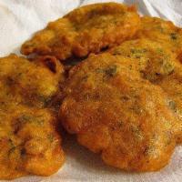 4 Bacalaitos Fritos · 4 fried codfish fritters.