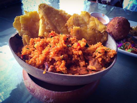 Arroz con Pollo · Yellow rice with chicken. Includes 3 plantains.