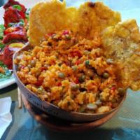 Arroz con Gandules · Yellow rice with green pigeon peas. Includes 3 plantains.