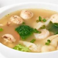 Wonton Soup · Wontons, shrimp, white chicken, broccoli, carrots, water chestnuts, and mushrooms.