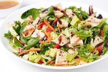 Chopped Asian Salad · Grilled chicken breast or grilled Alaskan salmon on organic spring mix, romaine, and iceberg, with carrots, red peppers, cilantro, green onions, sesame seeds, quinoa, and slivered almonds, served with a sweet Asian vinaigrette.