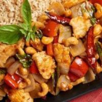 Thai Basil Cashew Chicken · White chicken wok tossed with red bell peppers, onions, basil leaves, red chili peppers and ...