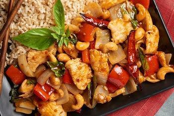 Thai Basil Cashew Chicken · White chicken wok tossed with red bell peppers, onions, basil leaves, red chili peppers and cashews in our savory sweet and mildly spicy cashew sauce. Spicy.