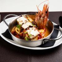 Shrimp Saganaki · Baked shrimp, tomato sauce, scallions, crumbled feta and white wine deglaze.