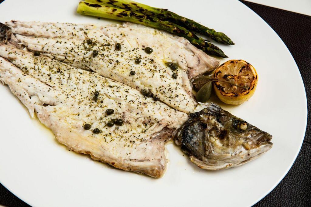 Lavraki · Grilled bronzini, lean white fish, mild and sweet and moist tender flakes.