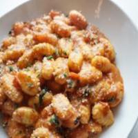 Gnocchi · Tomato, basil, and cream sauce. Served with a roll.