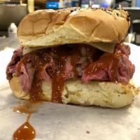 Super Hot Roast Beef on Onion Roll · Your choice of BBQ sauce, American cheese and mayonnaise. Grilled with hot roast beef sub an...