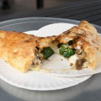 Calzone · Pizza dough stuffed and baked with ricotta and mozzarella. Served with a side of homemade sa...