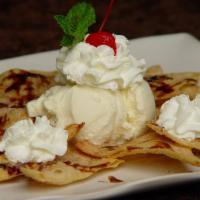 Sopapillas · Fried flour tortilla sprinkled with cinnamon and honey, served with vanilla ice cream. ***Pl...