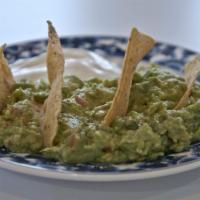Guacamole & Chips · Avocado dip with chips.