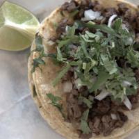 Carne Asada Taco · Skirt steak taco. Served with cilantro and onions.