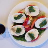 Caprese · Mozzarella, tomatoes and fresh basil topped with balsamic vinegar and olive oil.
