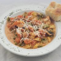 Tortellini alla Nonna · Cheese tortellini, prosciutto, peas, mushrooms and pink meat sauce.