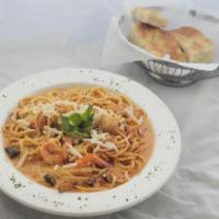 Shrimps and Scallops Pasta · Jumbo shrimps, scallops, mushrooms and fresh tomatoes in our homemade pink sauce.