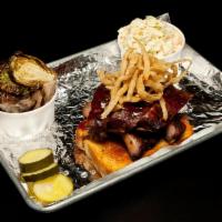 Baby Back Loin Ribs · Served with choice of 2 sides, Texas toast, and Devyn's homemade pickles.