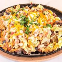 Ranch Skillet · Ham, sausage, bacon, diced onions, skillet brown potatoes, bell peppers, scrambled eggs, gra...