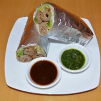 Spicy Seekh Kabab Wrap · Ground chicken kabab season with green chili, ginger and spices with grilled onions, cilantr...
