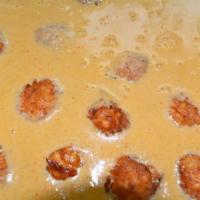 Malai Kofta Curry · Minced vegetable balls cooked in a cream of tomato sauce.