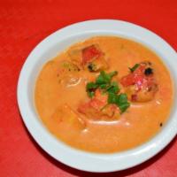 Butter Chicken Curry · Boneless tandoori chicken simmered in a mild tomato creamy sauce with cinnamon, cloves and s...