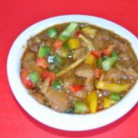 Kadai Chicken Curry · Boneless chicken pieces stir-fried with ginger, onions,bell peppers, tomatoes and spices.