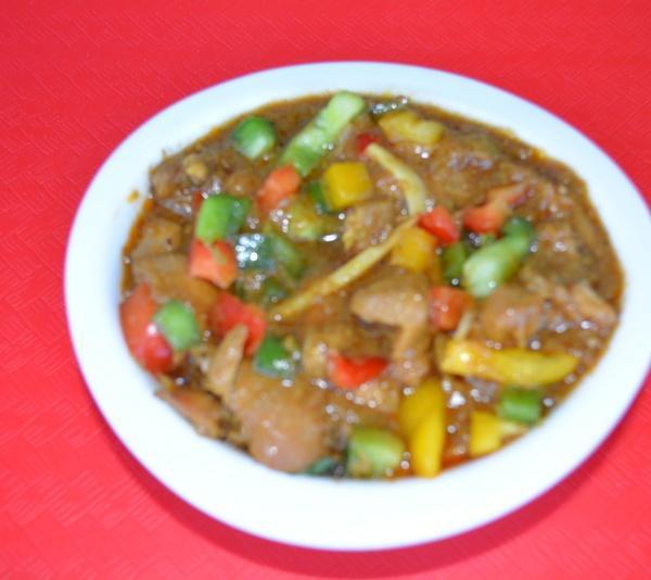 Kadai Chicken Curry · Boneless chicken pieces stir-fried with ginger, onions,bell peppers, tomatoes and spices.