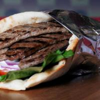 Beef Gyro with 2 Sides · Gyro Meat Lettuce Tomatoes and Tzatziki Sauce on your choice of Wrap or Pita Bread