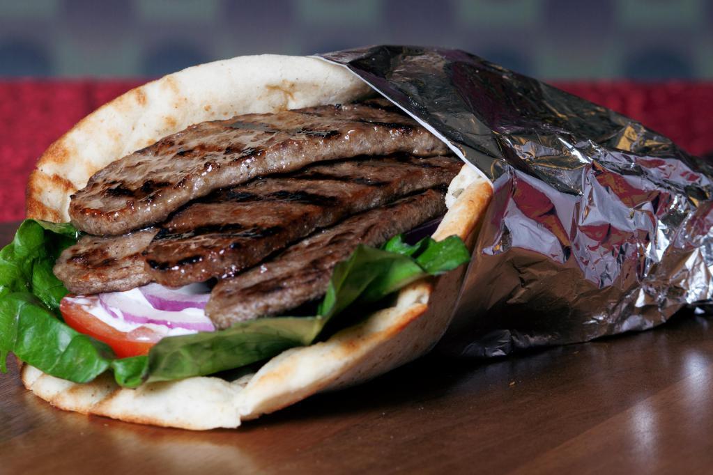 Beef Gyro with 2 Sides · Gyro Meat Lettuce Tomatoes and Tzatziki Sauce on your choice of Wrap or Pita Bread