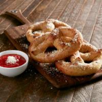 Garlic Butter and Parmesan Pretzel · Signature Mellow dough twisted into pretzels: garlic butter and Parmesan with a side of Mell...