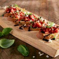 Bruschetta · Diced tomatoes, basil and seasonings tossed in balsamic vinegar and olive oil. Topped with f...
