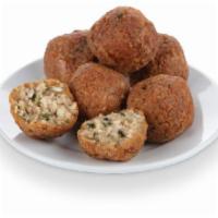 Boudin Bites · Rice and pork mixed with a blend of Cajun seasonings, rolled and battered to perfection!