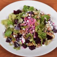 Red Beet Salad · Mixed greens, romaine, honey glazed walnuts, goat cheese and with our honey balsamic dressing.