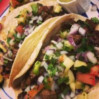 3 Carne Asada tacos · Marinated grilled flank steak.