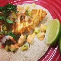 Beer Battered Fish Taco · Fried to order, topped with pineapple pico de gallo and spicy mayo.