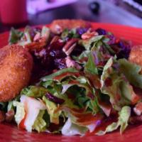 Goat Goddess Salad  · Crispy fried goat cheese balls, walnuts, cranberries, mixed greens and vinaigrette.