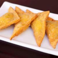 Cream Cheese Crab Puffs · Imitation crabmeat and cream cheese wrapped in wonton skin and deep-fried to a crisp.