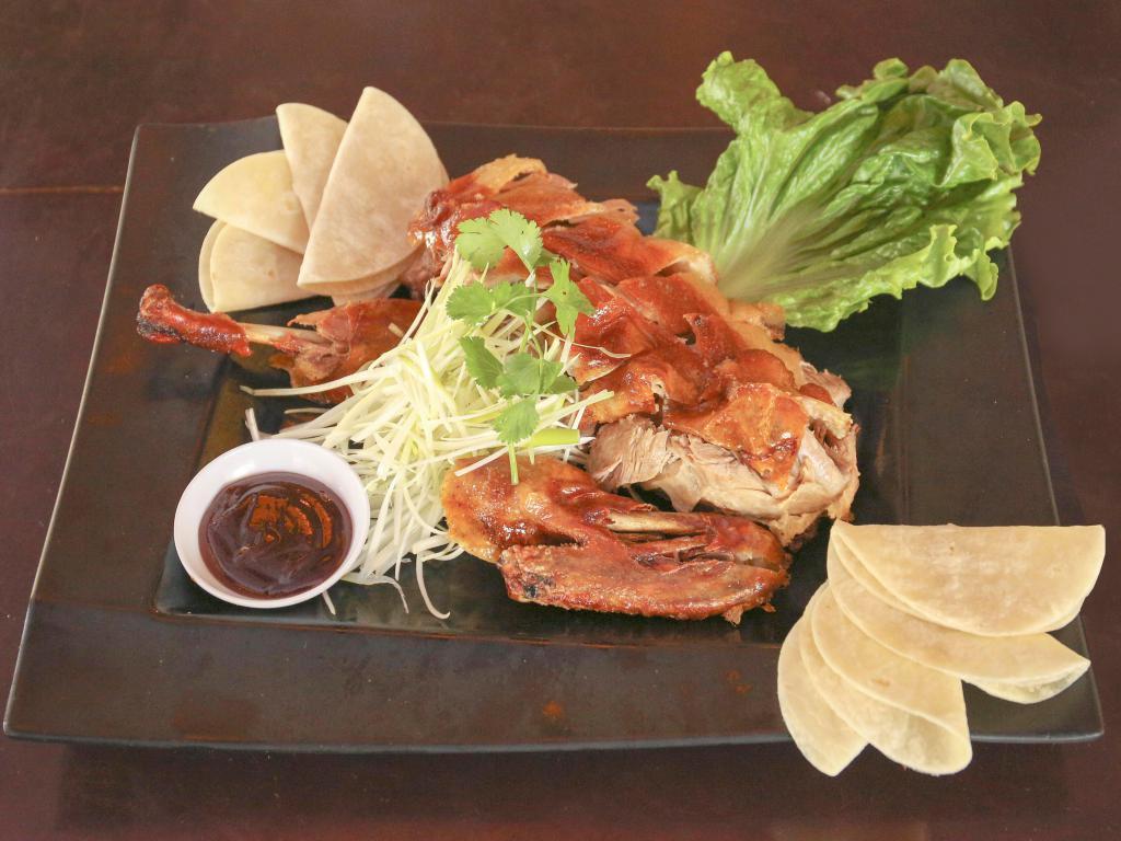 Peking Duck · Peking style BBQ duck served with scallion, hoisin sauce and thin pancakes.