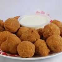 Breaded Mushrooms · With a small side of sauce.