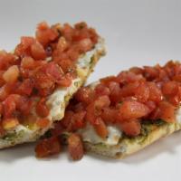 Bruschetta · Fresh Italian bread, basil pesto and sliced mozzarella cheese baked in the oven and topped w...