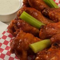 12 Buffalo Chicken Wings · Seasoned daily, flash fried to order and generously coated with a homemade buttery hot sauce...