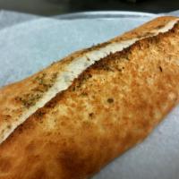 Traditional Stromboli · Slices of mozzarella, provolone, pepperoni, salami and ham rolled into our traditional Neapo...