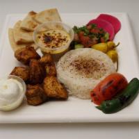 Chicken Kebab Plate · Grilled marinated chicken, shepherd salad, hummus, basmati rice, grilled tomato and jalapeno...