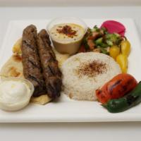 Lule (Shish) Kebab Plate · 2 skewers of spiced ground beef, shepherd salad, hummus, basmati rice, grilled tomato and ja...