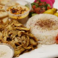 Chicken Shawarma Plate · Flame-broiled chicken, shepherd salad, hummus, basmati rice, pickled turnips, and pickled ch...
