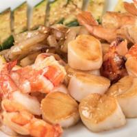 Ocean Treasure · Grilled cold water lobster tail with grilled sea scallops and colossal shrimp.