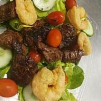 Surf and Turf Salad · Steak tips and shrimps over our garden salad.