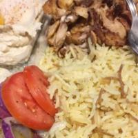 Chicken Shawerma Plate  · Served with rice, hummus, salad, pita, and garlic dip