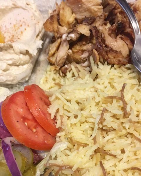 Chicken Shawerma Plate  · Served with rice, hummus, salad, pita, and garlic dip