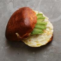 Breakfast Sandwich · Organic egg and cheddar on a brioche roll with organic harissa ketchup