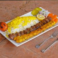 Beef and Chicken Combination Koobideh · 1 skewer of charbroiled ground beef kabob and 1 skewer of ground chicken kabob served with b...