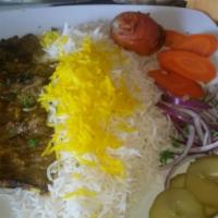 20. Shish Kabob · Chunks of skewered marinated filet mignon. Served with broiled tomato, vegetables and basmat...